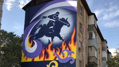 В Алматы появился мурал с изображением пожарного-спасателя